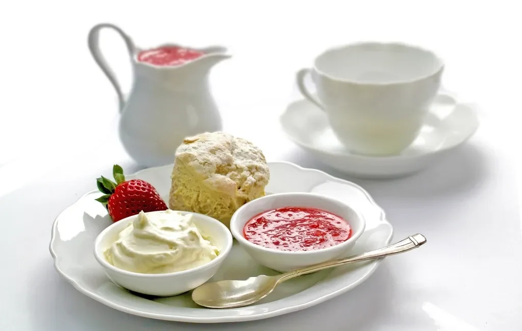 Cream tea with a scone, cream and jam