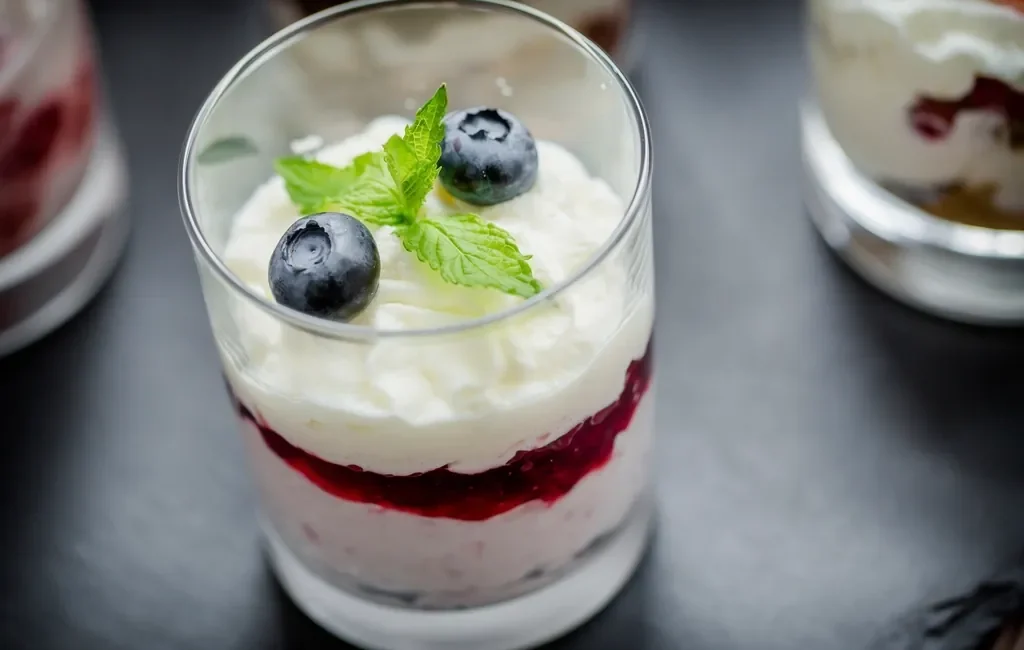 Blueberry mousse in a glass with fresh blueberries
