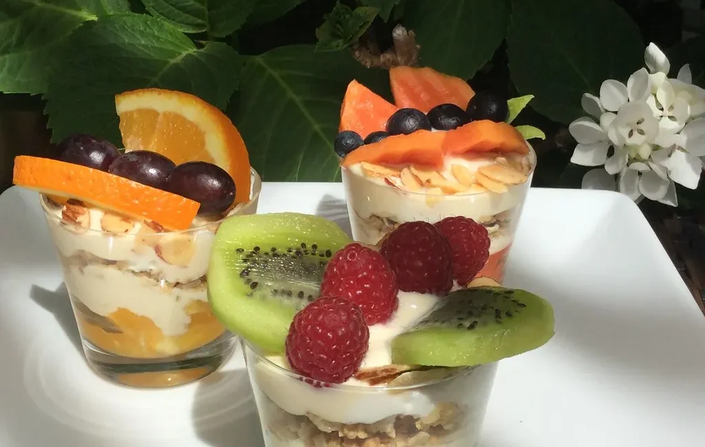 Fruit parfaits layered in small glasses
