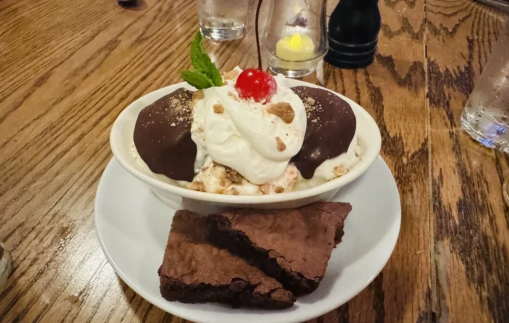 Ice cream sundae with whipped cream and a cherry